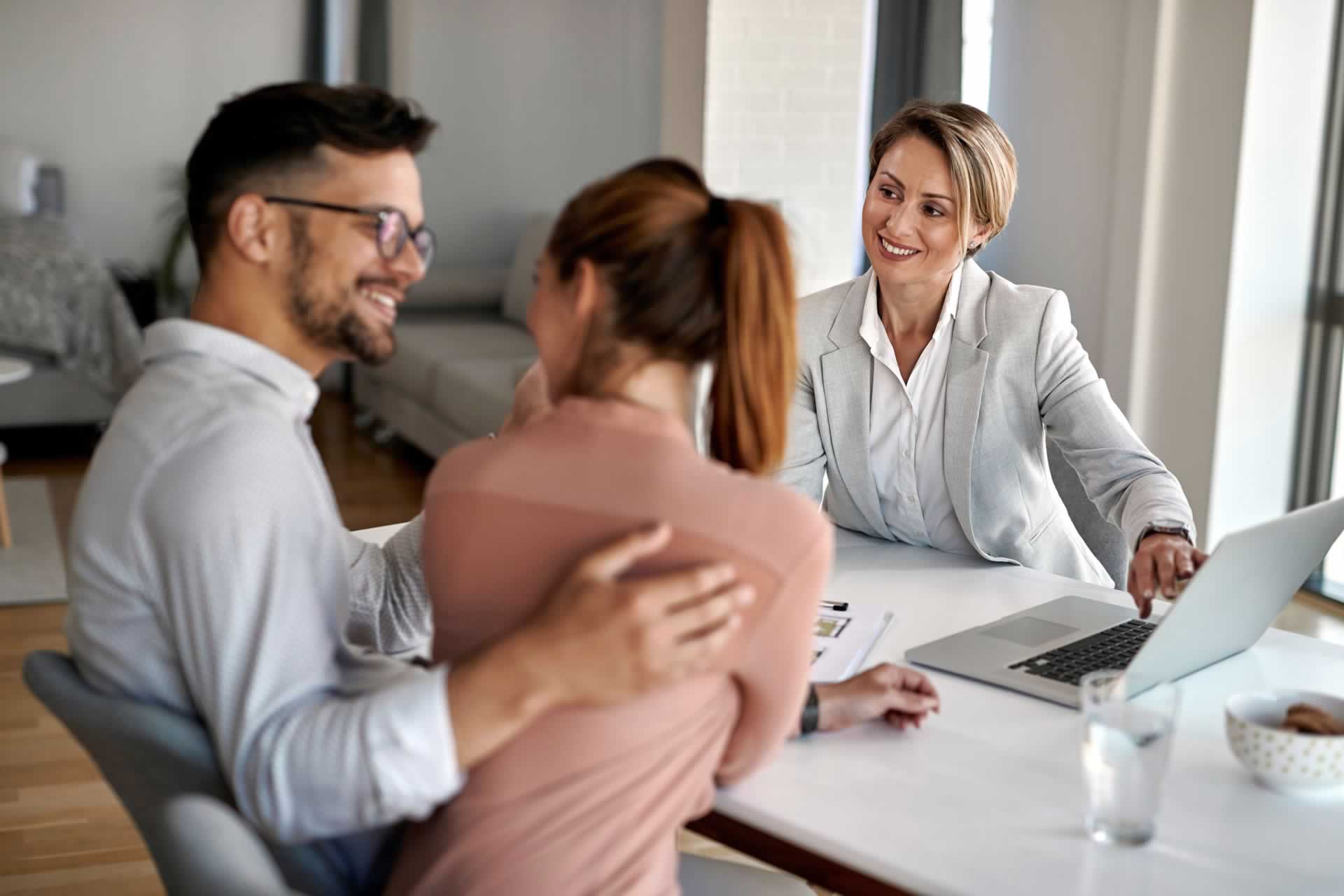 Business professionals reviewing charts and reports during a partnership meeting